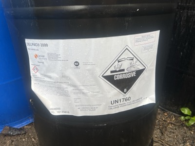 DELPAC 2000 corrosive chemical drum label — aluminum chloride hydroxide sulfate, UN1760